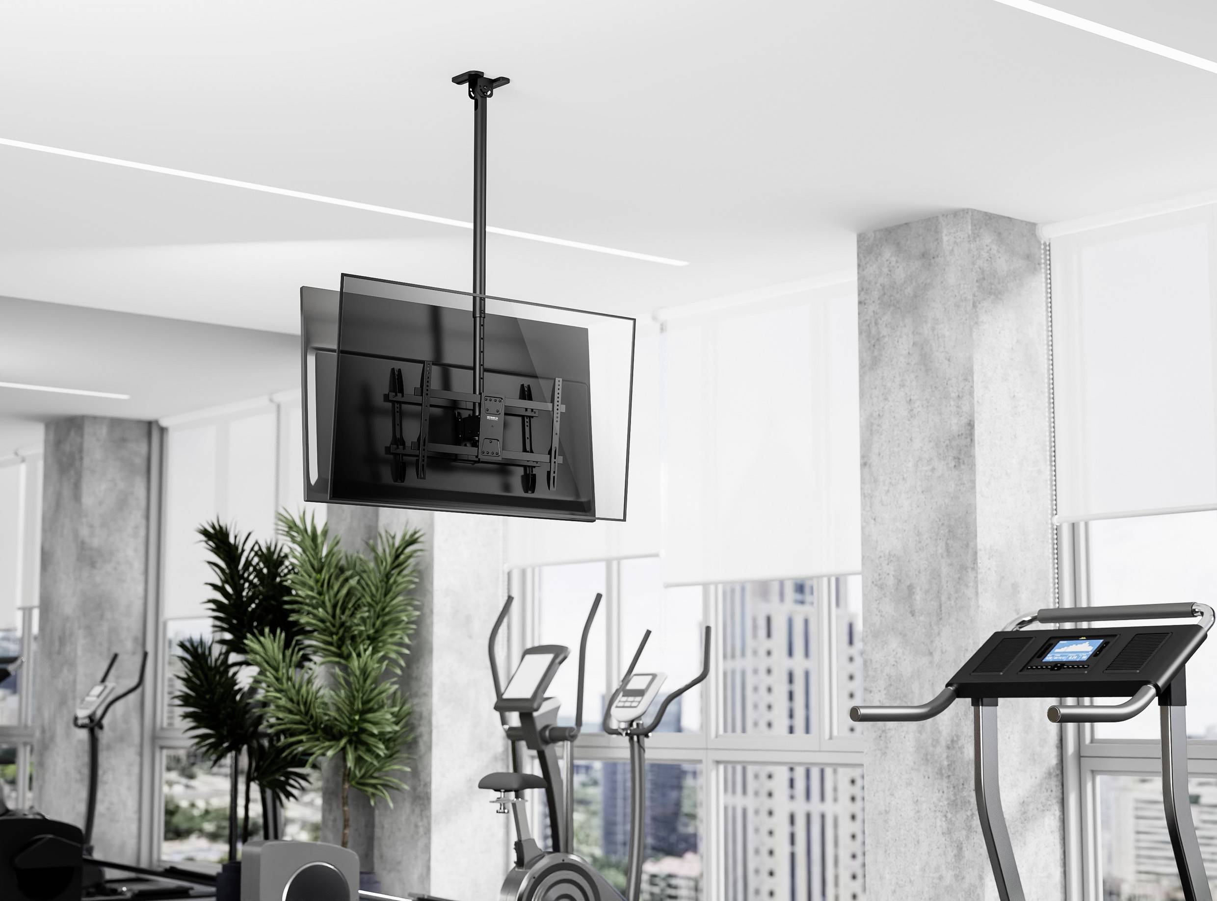 Ein modernes Fitnessstudio mit Trainingsgeräten, darunter ein Laufband und Standfahrräder. An der Wand ist ein Fernseher montiert, mit Blick auf die Stadtlandschaft.