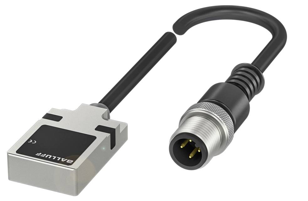 Ein silberner, rechteckiger elektrischer Sensor mit schwarzer Beschriftung und rundem Anschlusskabel mit Metallstecker und mehreren Kontakten.