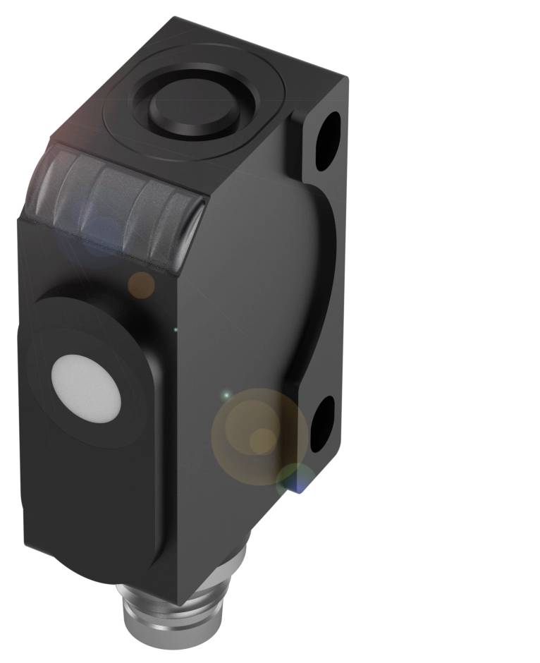 Ein schwarzer, rechteckiger Sensor mit rundem, weißen Erkennungsbereich und zwei Schraublöchern.
