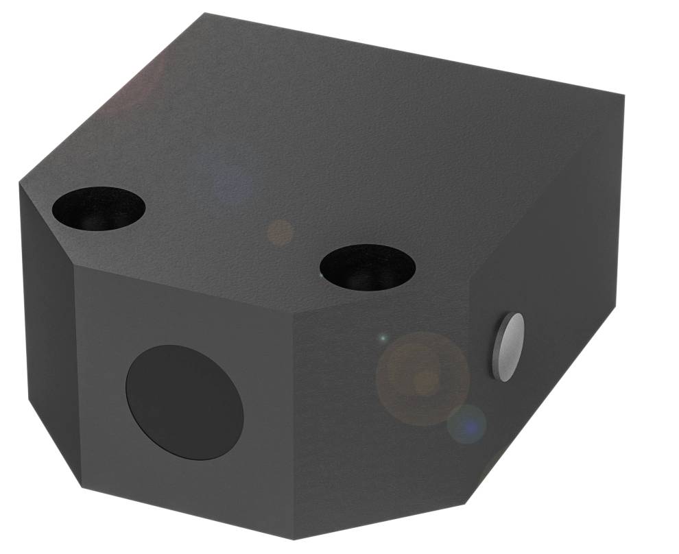 Ein schwarzes, quaderförmiges Objekt mit abgerundeten Ecken und zwei runden Öffnungen an der Oberseite, eine auf der rechten Seite.