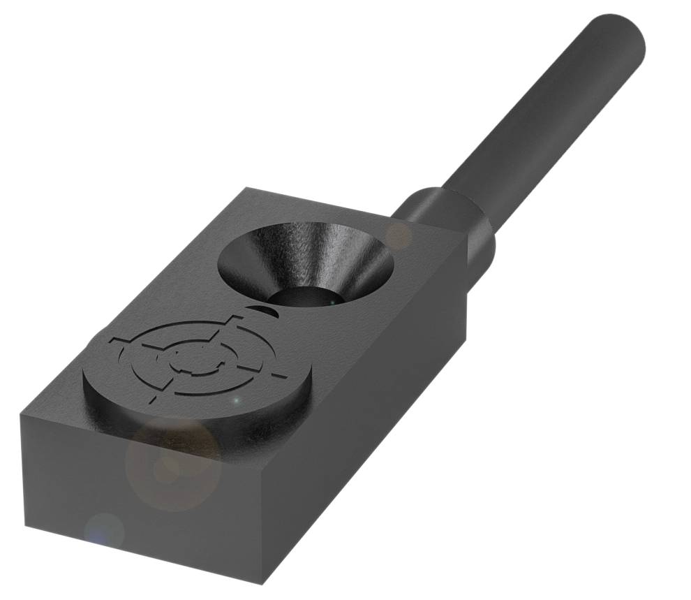 Ein metallisches Bauteil mit einem zylindrischen Griff und einer rechteckigen Basis mit kompliziertem Muster.