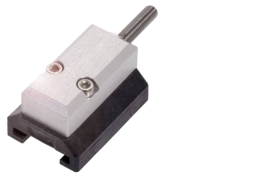 Metallkomponente mit Schraube auf schwarzer Halterung, möglicherweise Teil einer mechanischen oder elektronischen Vorrichtung.