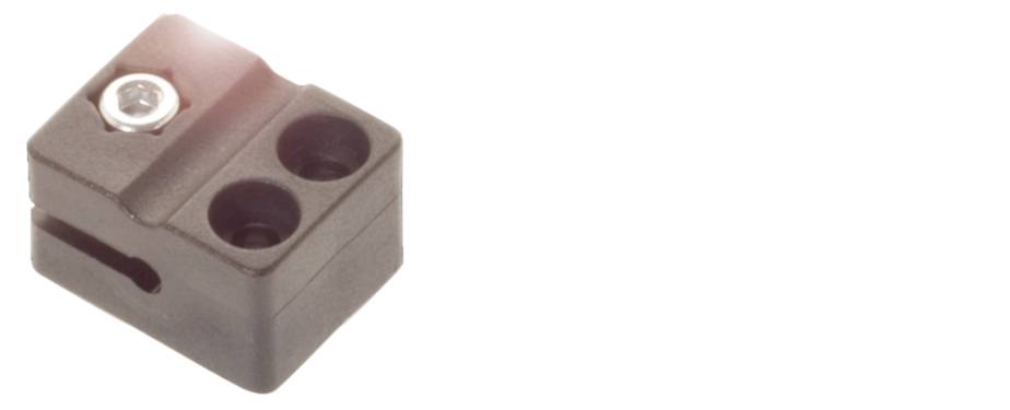 Ein schwarzer, rechteckiger Kunststoff-Steckverbinder mit zwei Löchern und einer Schraube oben links.
