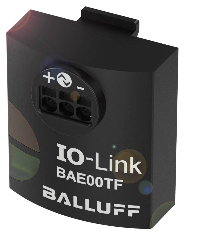 Schwarzes, rechteckiges elektrisches Gerät mit der Aufschrift 'IO-Link BAE00TF BALLUFF'. Oben sind Plus- und Minuspole zu sehen.