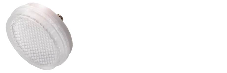 Ein rundes, durchsichtiges Plastikteilen mit einem gitterartigen Muster. Es könnte Teil eines größeren mechanischen oder elektronischen Geräts sein.