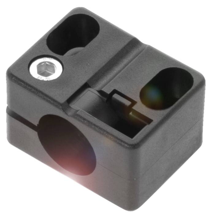 Schwarzes, kubisches Kunststoffteil mit drei Löchern, eines enthält eine Schraube. Möglicherweise für mechanische Befestigungen.