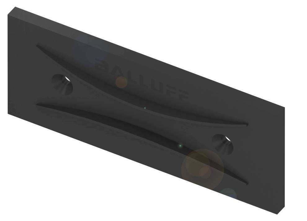 Schwarzes rechteckiges Kunststoff-Element mit geschwungenen Vertiefungen und zwei Bohrungen. Im Hintergrund der Schriftzug 'BALLUFF'.