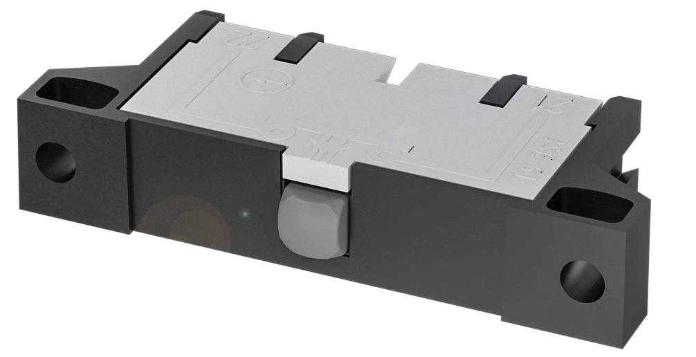 Ein rechteckiger, flacher elektronischer Komponentenschalter in schwarz und grau, mit zwei sichtbaren Befestigungslöchern an jeder Seite.