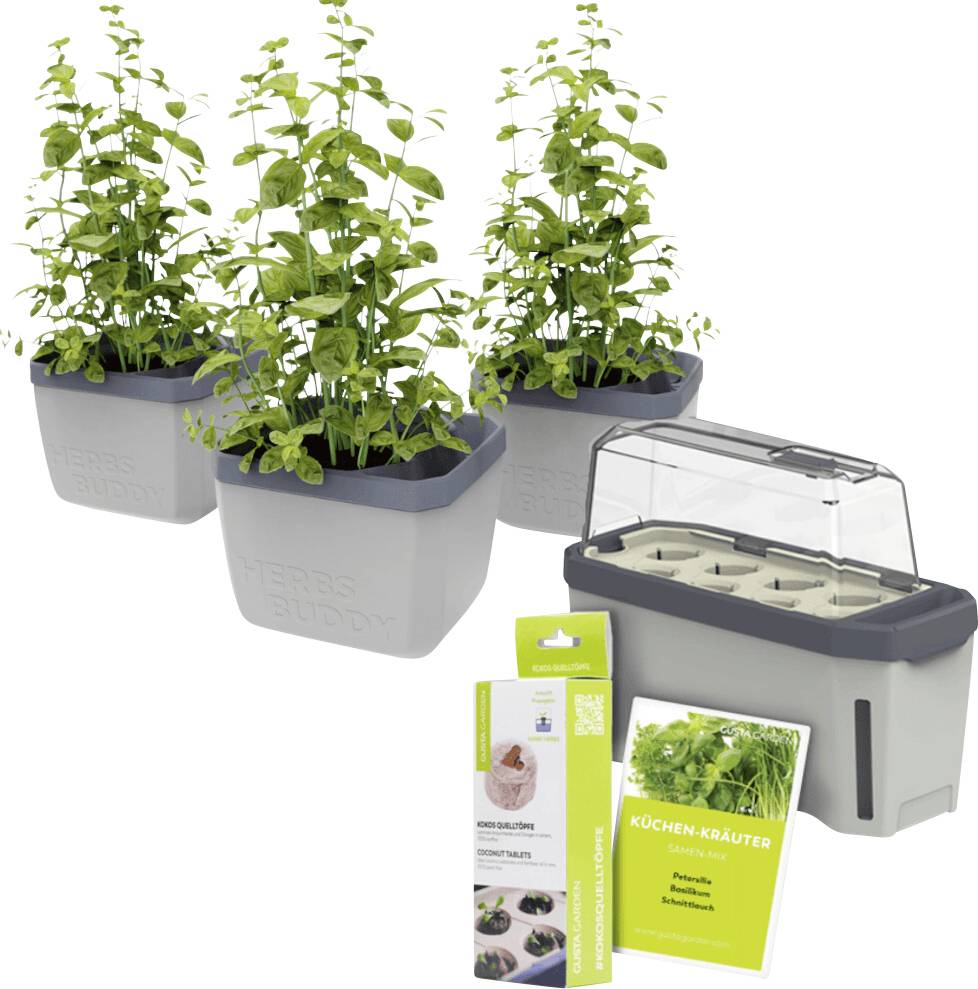 Drei mit Küchenkräutern bepflanzte Töpfe neben einem Mini-Gewächshaus. Daneben steht eine Verpackung mit Anleitungen zur Pflanzenpflege.