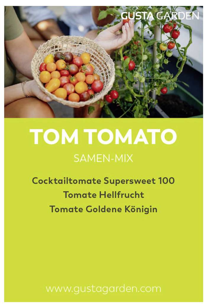 'TOM TOMATO SAMEN-MIX' in Großbuchstaben, mit drei Tomatensorten: Cocktailtomate Supersweet 100, Tomate Hellfrucht, Tomate Goldene Königin, davor eine Schale mit bunten Tomaten.