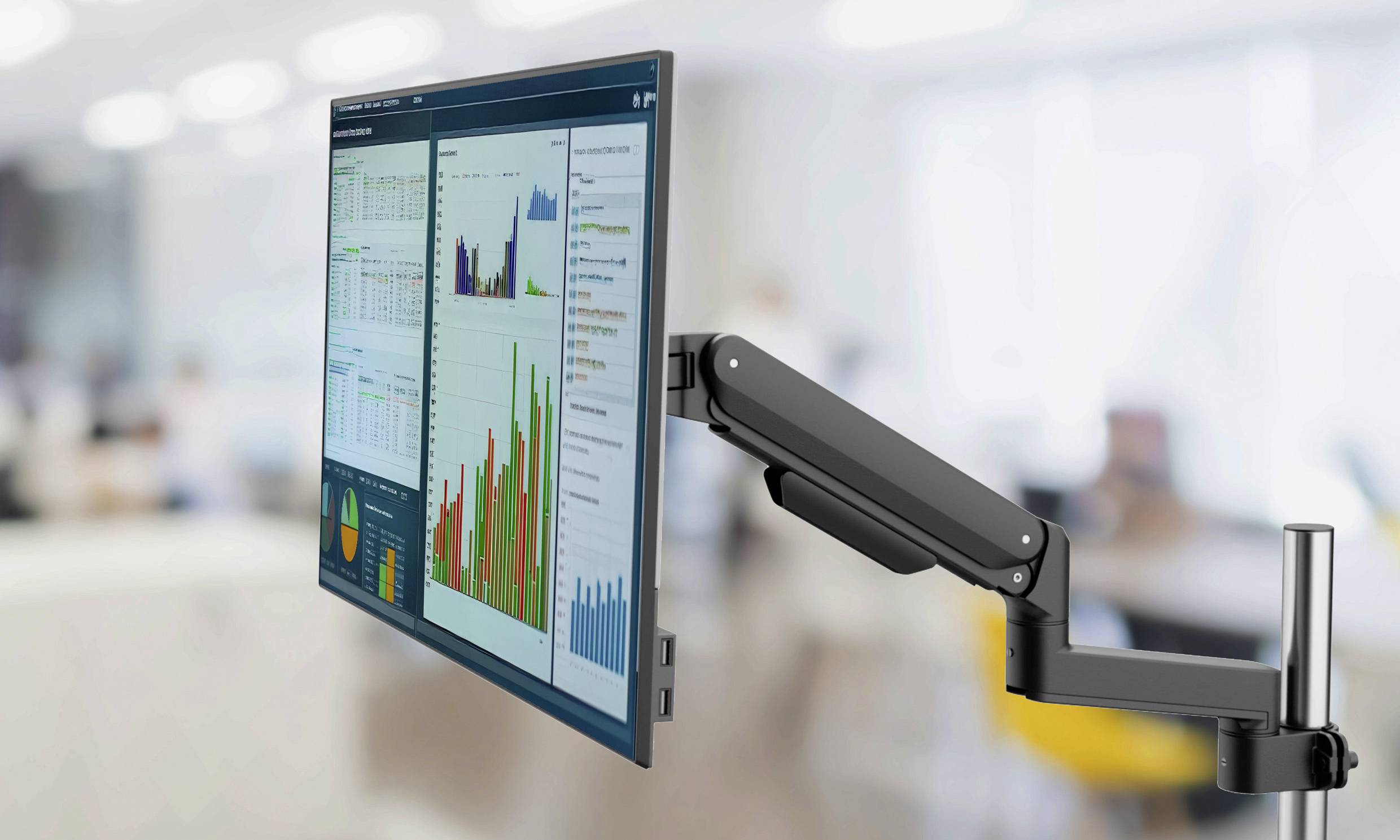 Ein Monitor an einem verstellbaren Arm, der verschiedene Datencharts und Grafiken in einer Büroumgebung zeigt.