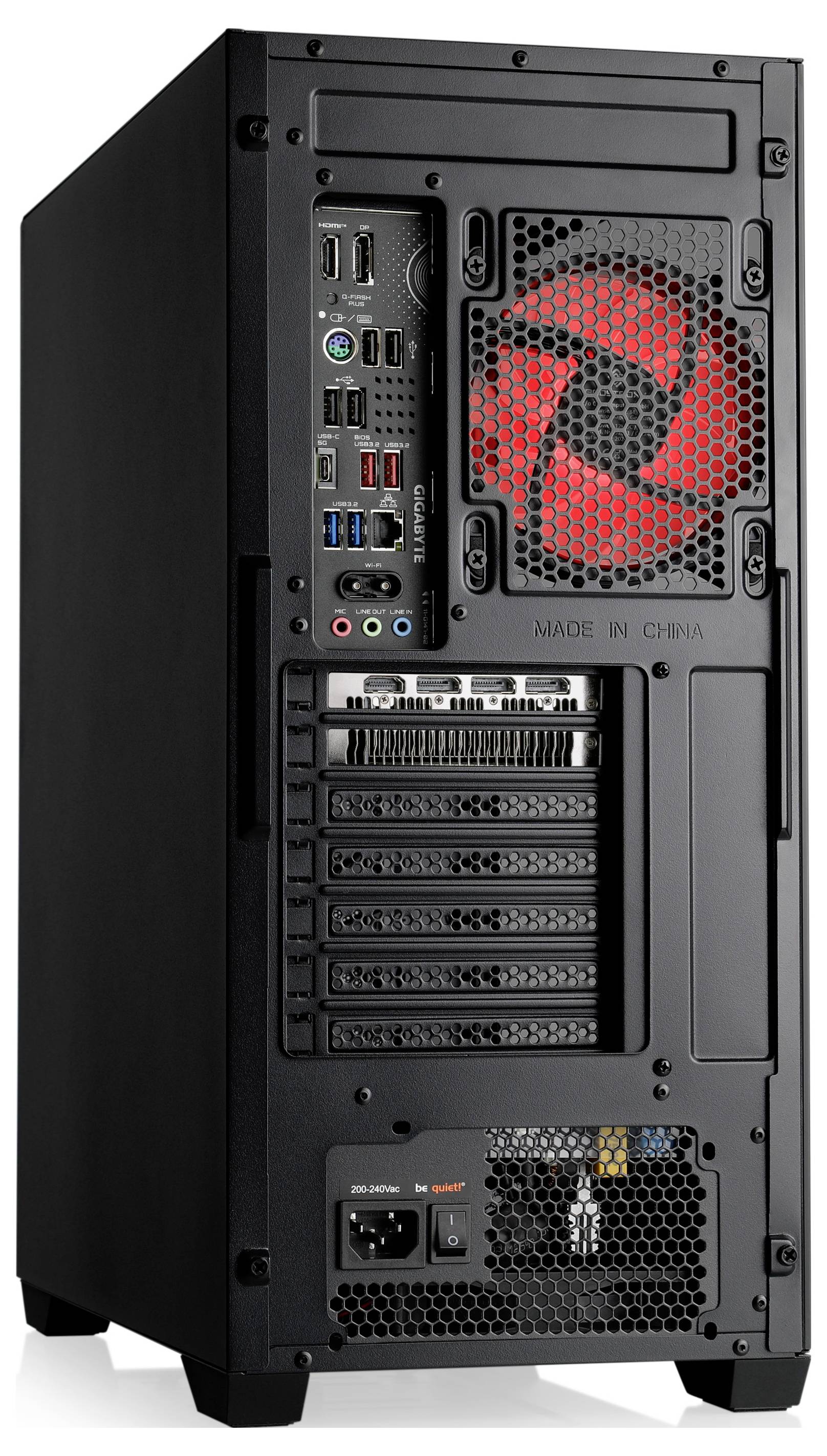 Das Bild zeigt die Rückseite eines schwarzen Computertowers mit einem roten Lüfter, mehreren USB- und Audioports sowie Erweiterungssteckplätzen.