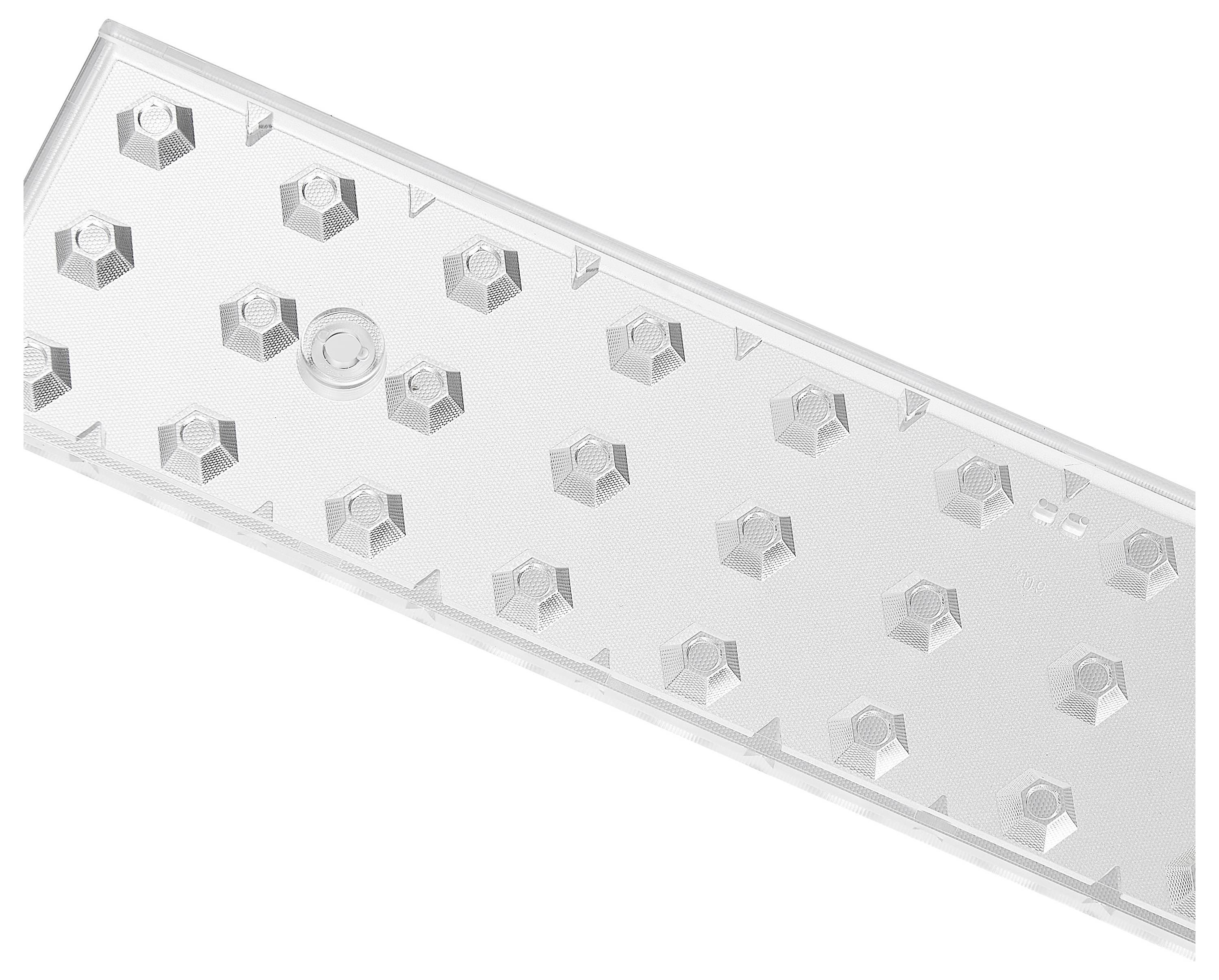 Ein transparentes Kunststoffteil mit einer Reihe von kleinen, sechseckigen Erhebungen, wahrscheinlich ein technisches Bauteil.