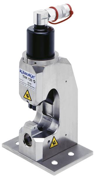 Ein hydraulischer Crimpwerkzeug mit einer Metallic-Basis und Zylinder, markiert als 'Klauke THK 120', der für schwere Crimpaufgaben verwendet wird.