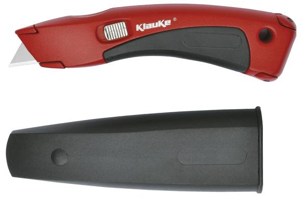 Ein roter und schwarzer Utility-Messer mit einer Sicherheitsabdeckung, die daneben liegt.
