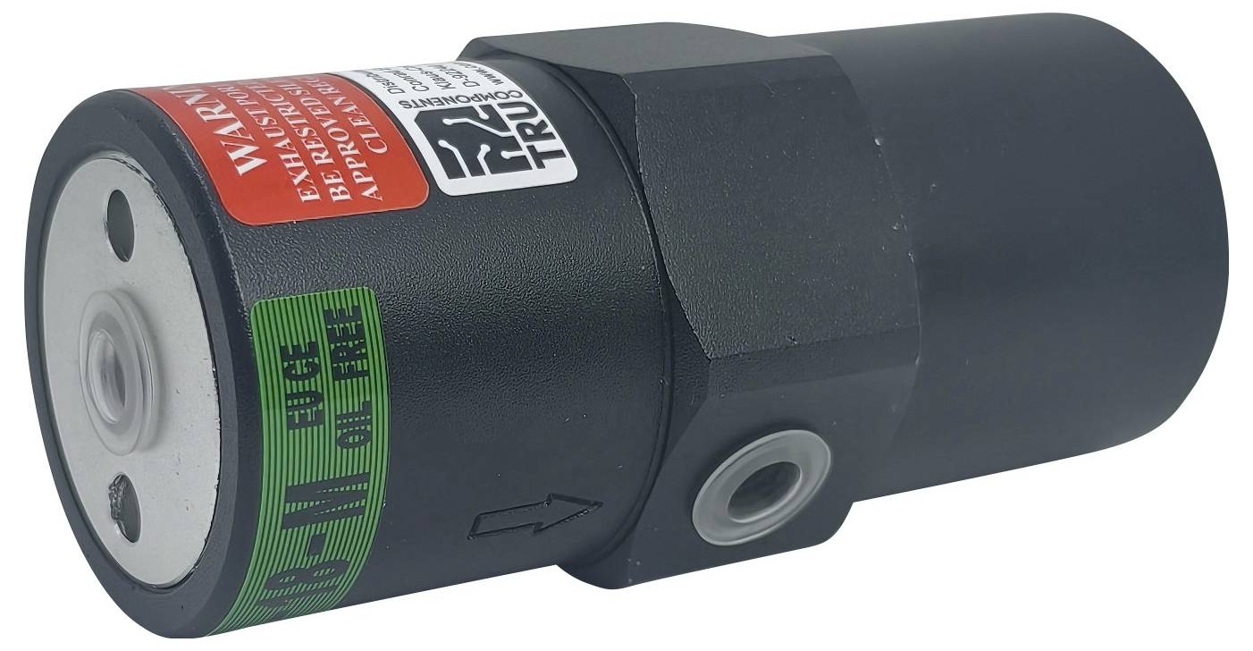 Ein schwarzes hydraulisches Ventil mit roter Warnungsaufschrift und grüner Aufschrift ‚Bypass geschlossen', das einen Pfeil zur Anzeige der Strömungsrichtung zeigt.