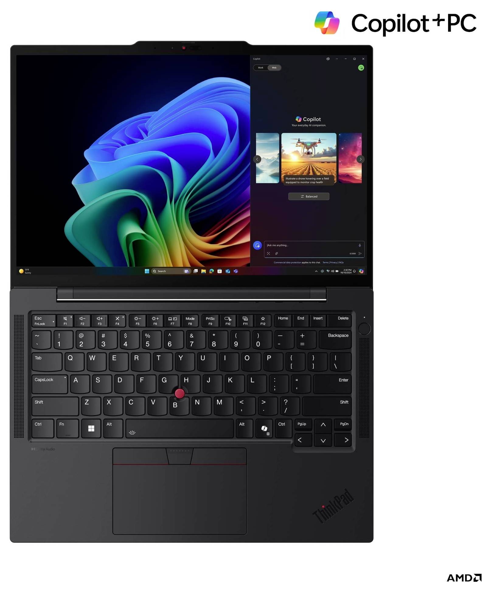 Ein schwarzer Laptop mit einer bunten Spirale auf dem Bildschirm und 'Copilot+PC' in der Ecke. Tastatur und Trackpad sind unterhalb des Bildschirms sichtbar.