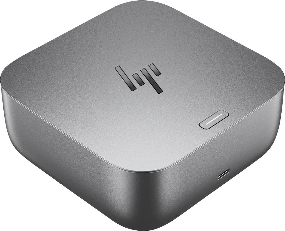 Ein kompaktes, graues elektronisches Gerät mit einem Logo auf der Oberseite, das einen einzelnen Knopf und einen Anschluss aufweist, möglicherweise Teil eines Computersystems.