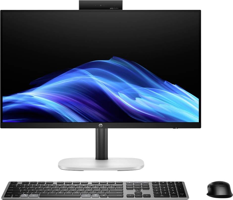 Eine Desktop-Computereinrichtung mit einem großen Monitor, der ein blaues Wellendesign zeigt, mit einer Tastatur und Maus, die davor positioniert sind.