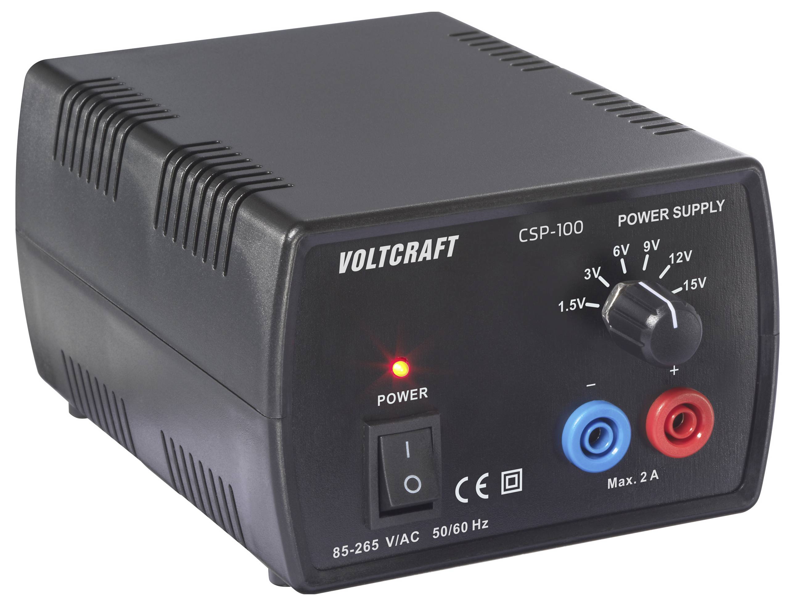 Schwarzes Voltcraft CSP-100 Netzteil mit einem Drehregler zur Spannungswahl und roten/blauen Anschlüssen. Eine rote LED zeigt an, dass das Gerät eingeschaltet ist.