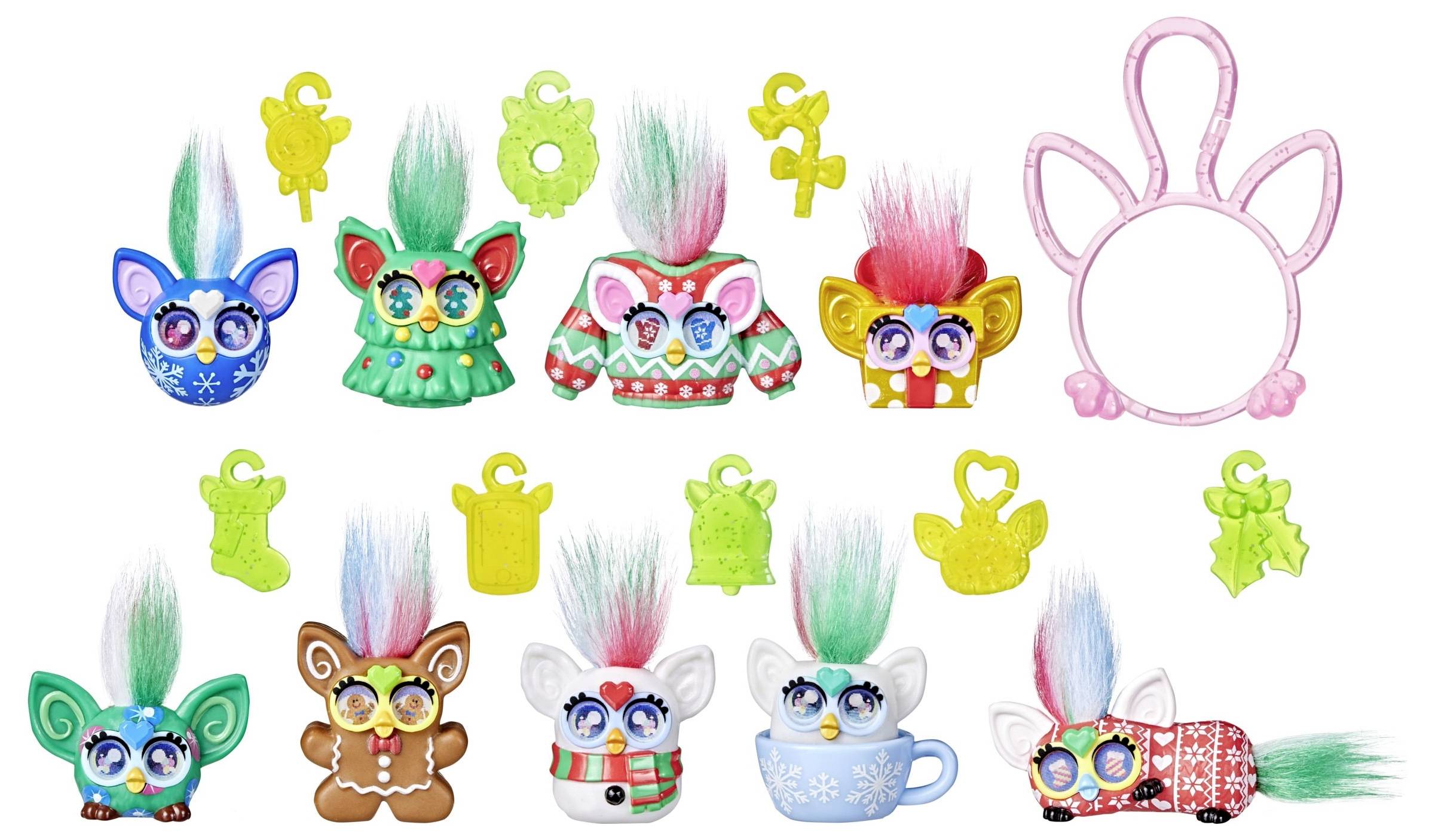 Bunte Spielzeuge, die kleinen Kreaturen mit großen Augen und zotteligen Haaren ähneln, in verschiedenen Outfits, umgeben von grünen Amuletten und einem pinken Rahmen.