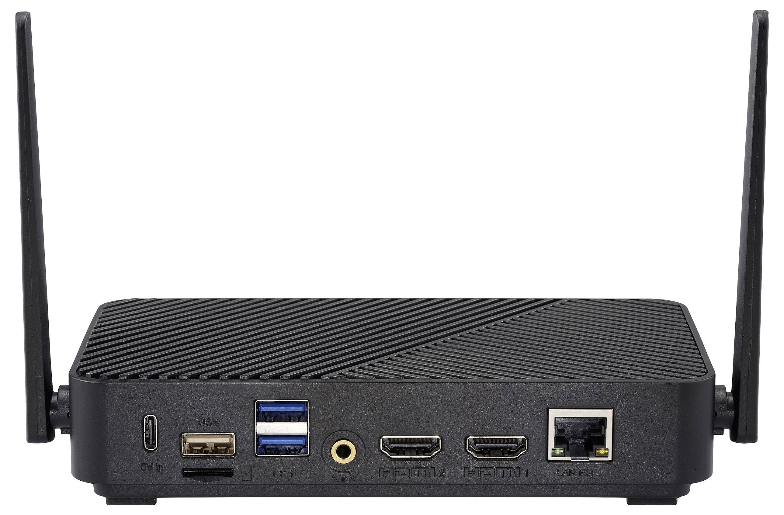 Rückansicht eines schwarzen Mini-PCs mit zwei Antennen, die Anschlüsse wie HDMI, USB, Ethernet und Audioausgang auf einer texturierten Oberfläche zeigt.