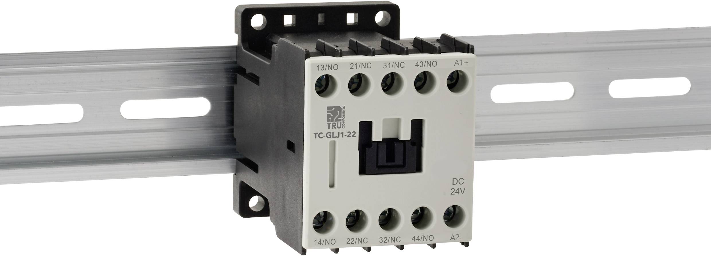 Ein Schütz, das auf einer Metallschiniene (DIN-Schiene) montiert ist, mit beschrifteten Anschlusspunkten und der Kennzeichnung 'DC 24V', verwendet für elektrische Schaltkreise.