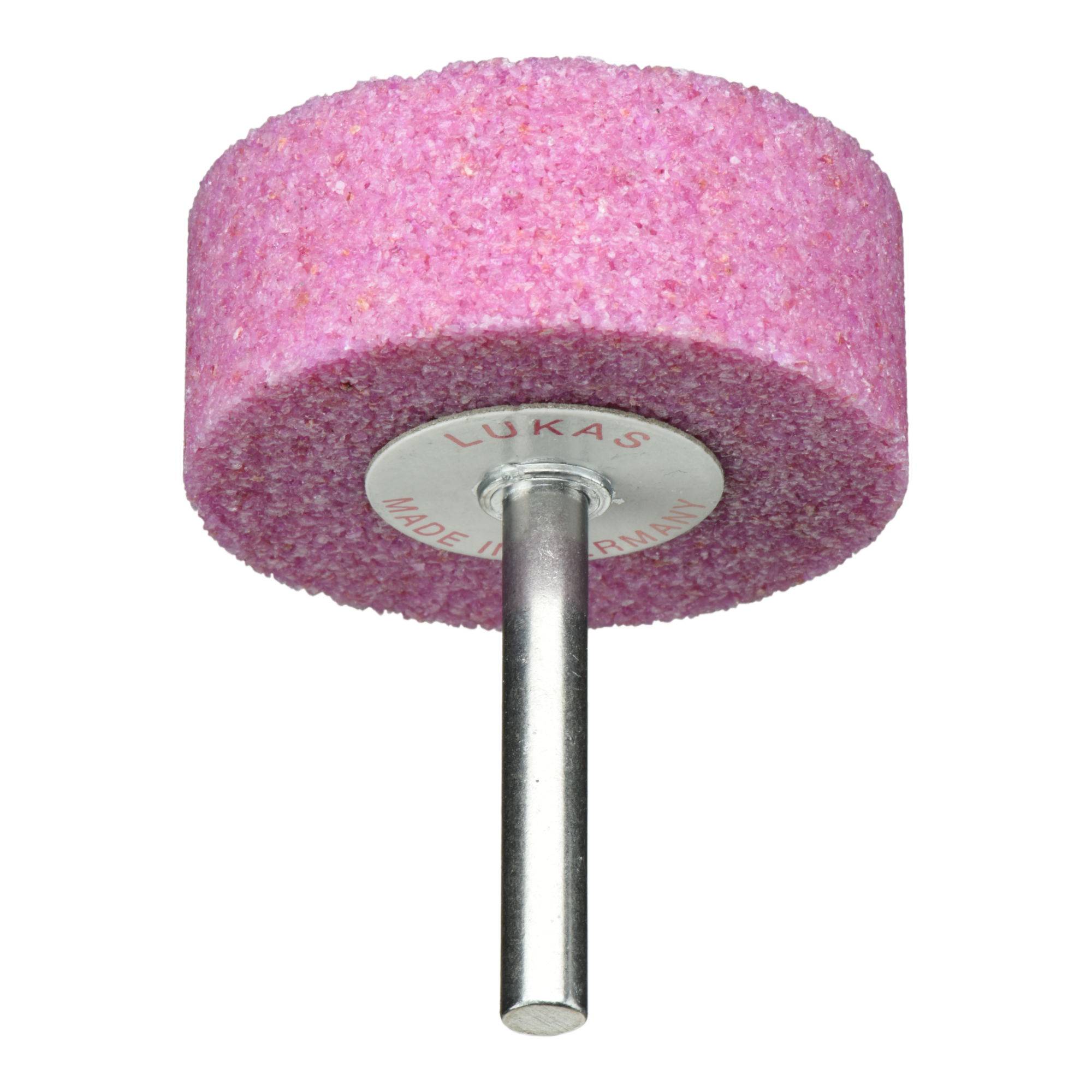 Ein rosa zylindrischer Schleifstein mit einer Metalldrehachse, beschriftet mit 'LUKAS Made in Germany.'