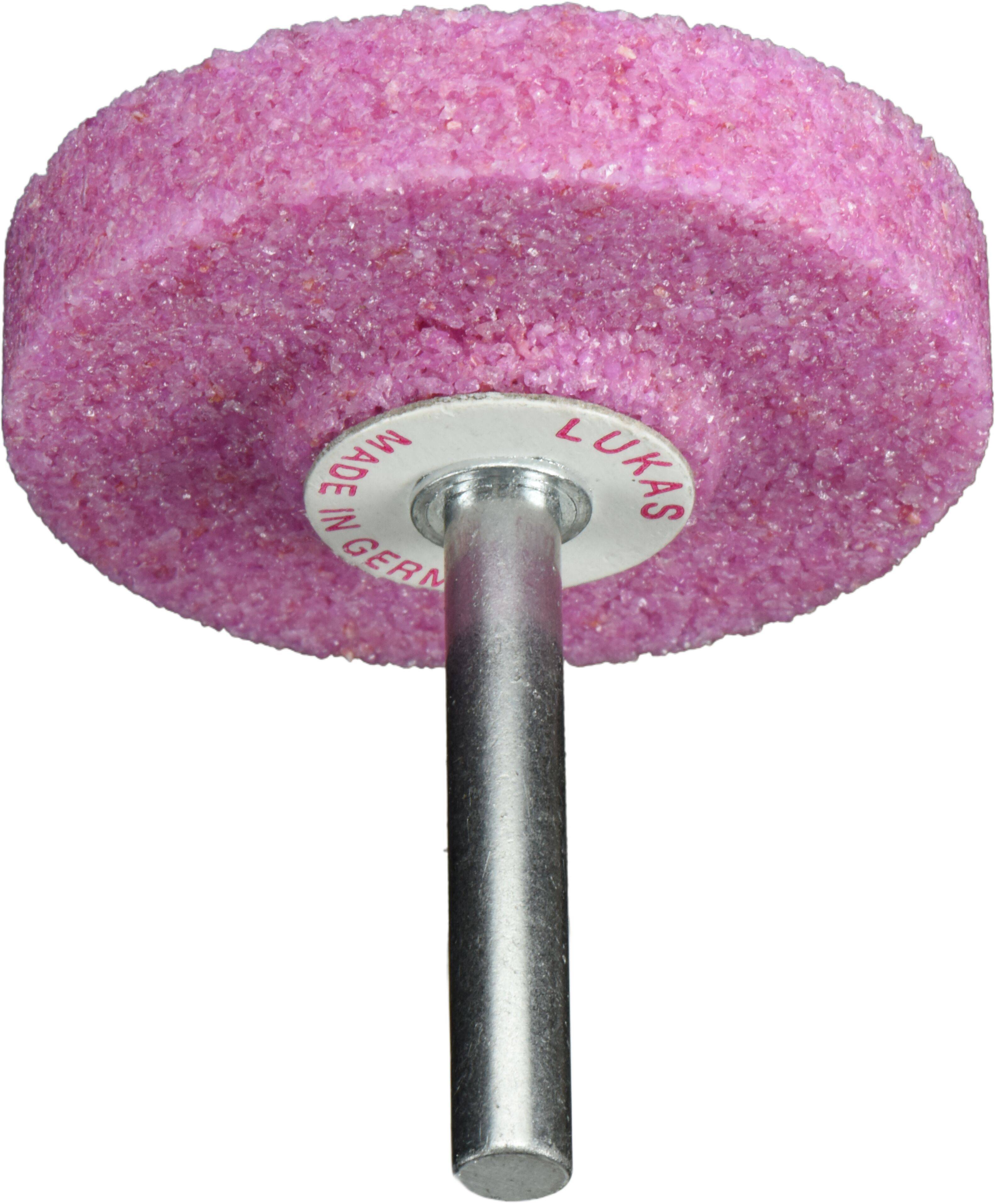 Rosa zylindrische Schleifscheibe mit einer Metallstange, verwendet zum Schärfen oder Polieren. Beschriftet mit 'LUKAS', 'MADE IN GERMANY'.