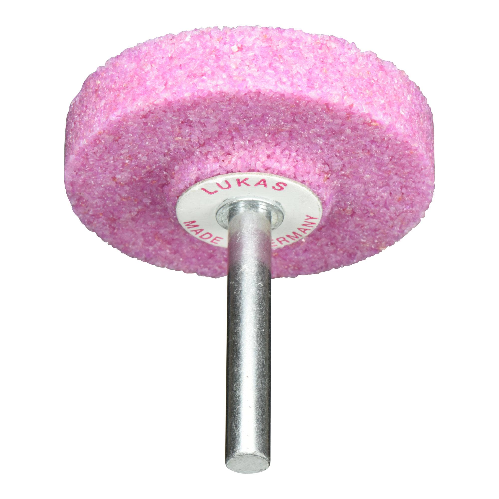 Ein rosa Schleifscheibe mit einer zentralen Metallwelle. Die Scheibe ist mit 'LUKAS MADE IN GERMANY' beschriftet.