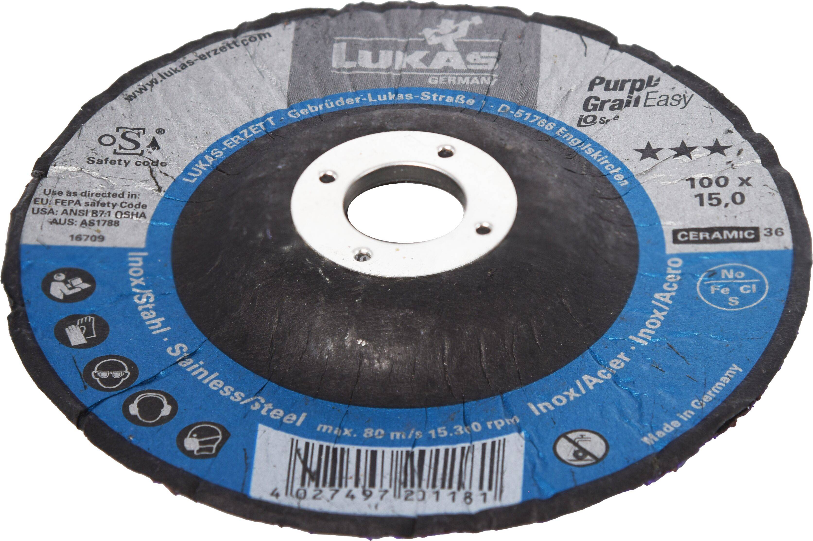 Trennscheibe mit blauem Etikett. Text enthält 'Edelstahl', 'Purp!Grain Easy' und Sicherheitsinformationen. Zentrales Loch zur Befestigung.