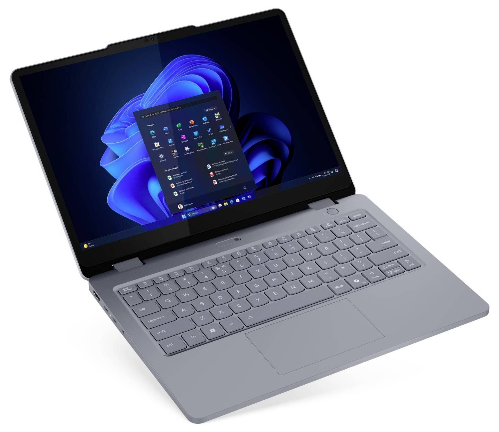 Ein Laptop mit einer grauen Tastatur zeigt den Windows 11 Startbildschirm.