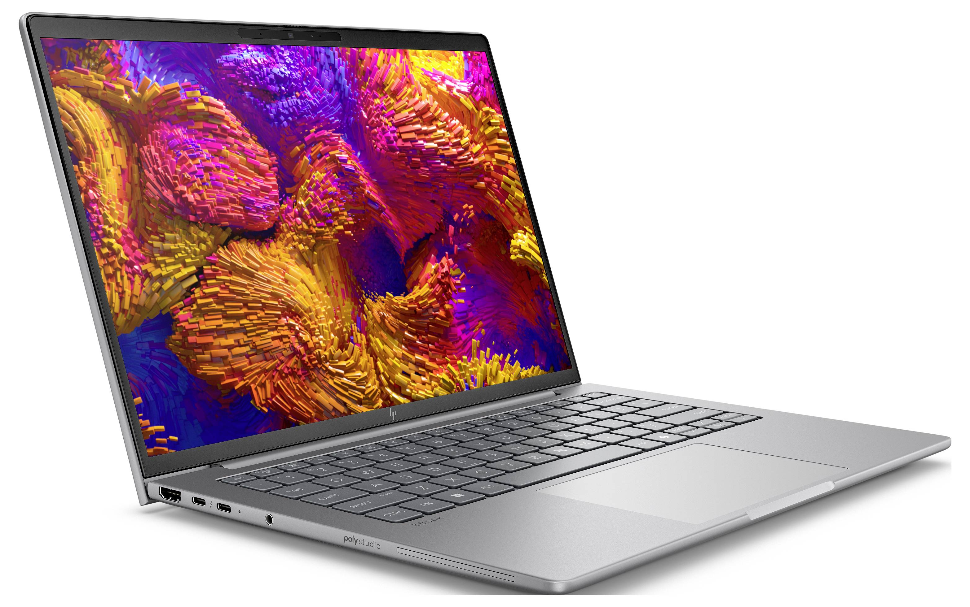 Ein schlankes silbernes Laptop, das ein lebendiges, abstraktes Kunstdesign auf seinem Bildschirm zeigt, zusammengesetzt aus einer lebhaften Mischung von rosa, orange und blauen Farbtönen.