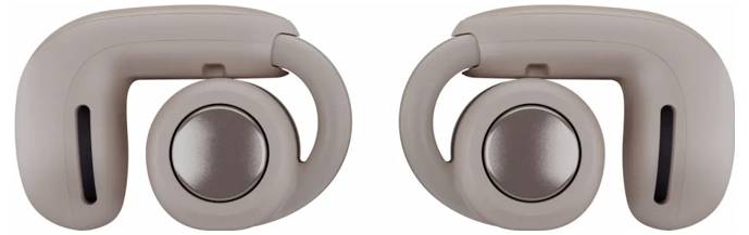 Ein Paar beige kabellose Ohrhörer mit einer Schleifenform, versehen mit einem kreisrunden Knopf auf jedem Hörer.