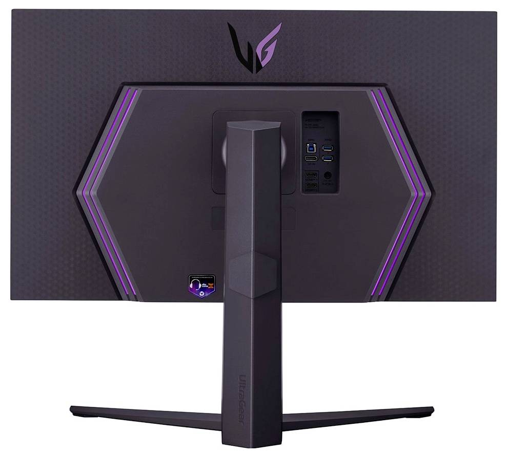 Rückansicht eines großen Gaming-Monitors mit hexagonaler Designstruktur und violetten LED-Akzenten. Ausgestattet mit mehreren Anschlüssen für Konnektivität.