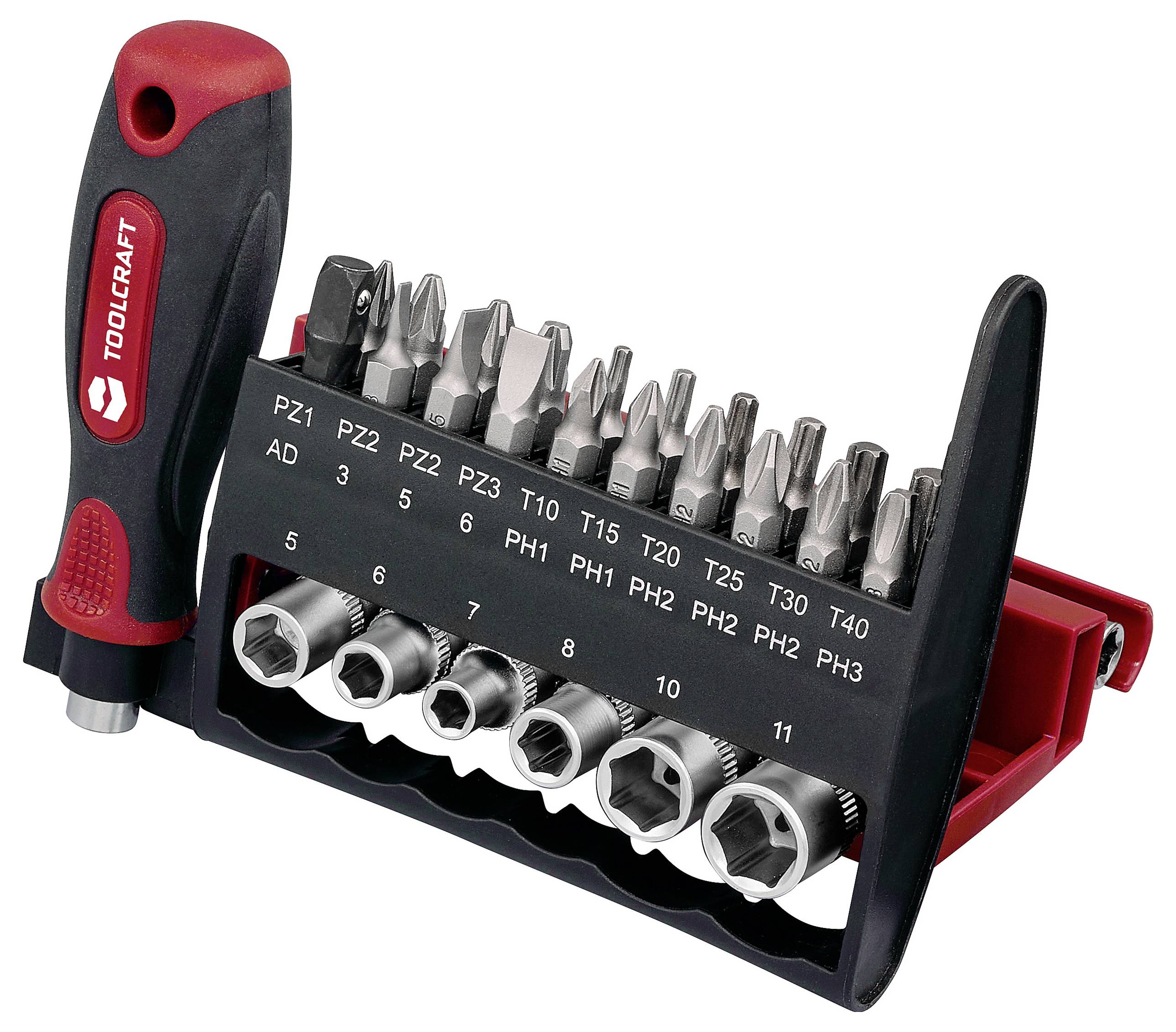 Ein Satz verschiedener Schraubendreher-Bits und Steckschlüssel mit einem Griff, beschriftet mit Größen und Typen, in einem kompakten schwarz-roten Halter organisiert.