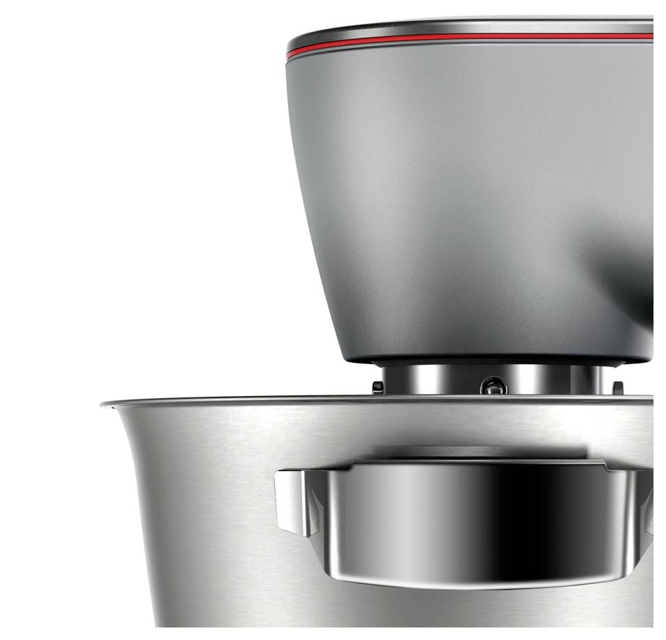 Nahaufnahme eines metallischen Küchengeräts, möglicherweise eines Mixers, mit Fokus auf sein elegantes Edelstahldesign und moderne Merkmale.