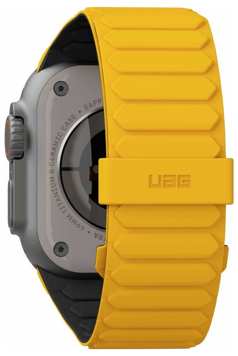 Eine Smartwatch mit rundem Display und orangefarbenen Bändern, von der Seite gezeigt. Die Uhr hat einen großen Knopf und einen sichtbaren Armbandbügel.