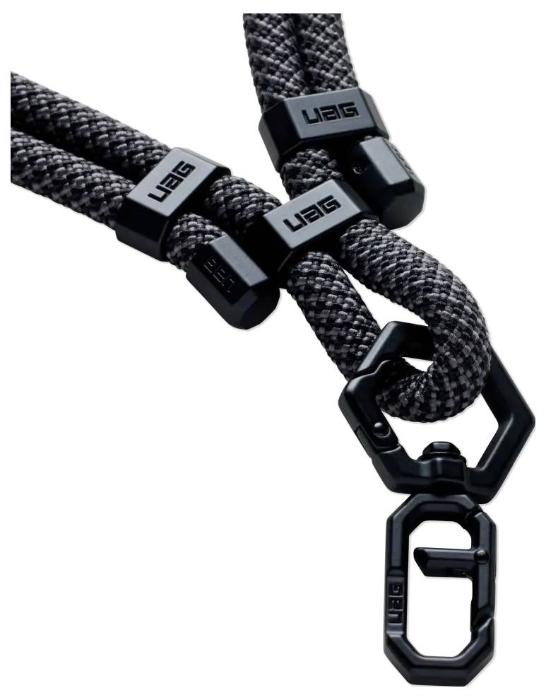 Eine Nahaufnahme eines schwarzen und grauen geflochtenen Seilschlüsselanhängers mit schwarzen Verbindern und einem Wirbelhaken, mit 'UAG'-Branding auf den Verbindern.