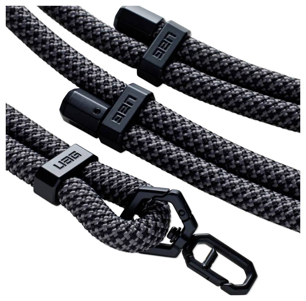 Graue und schwarze geflochtene Kabel mit schwarzen Anschlüssen und Clip, mit 'UAG' Branding auf den Anschlüssen.