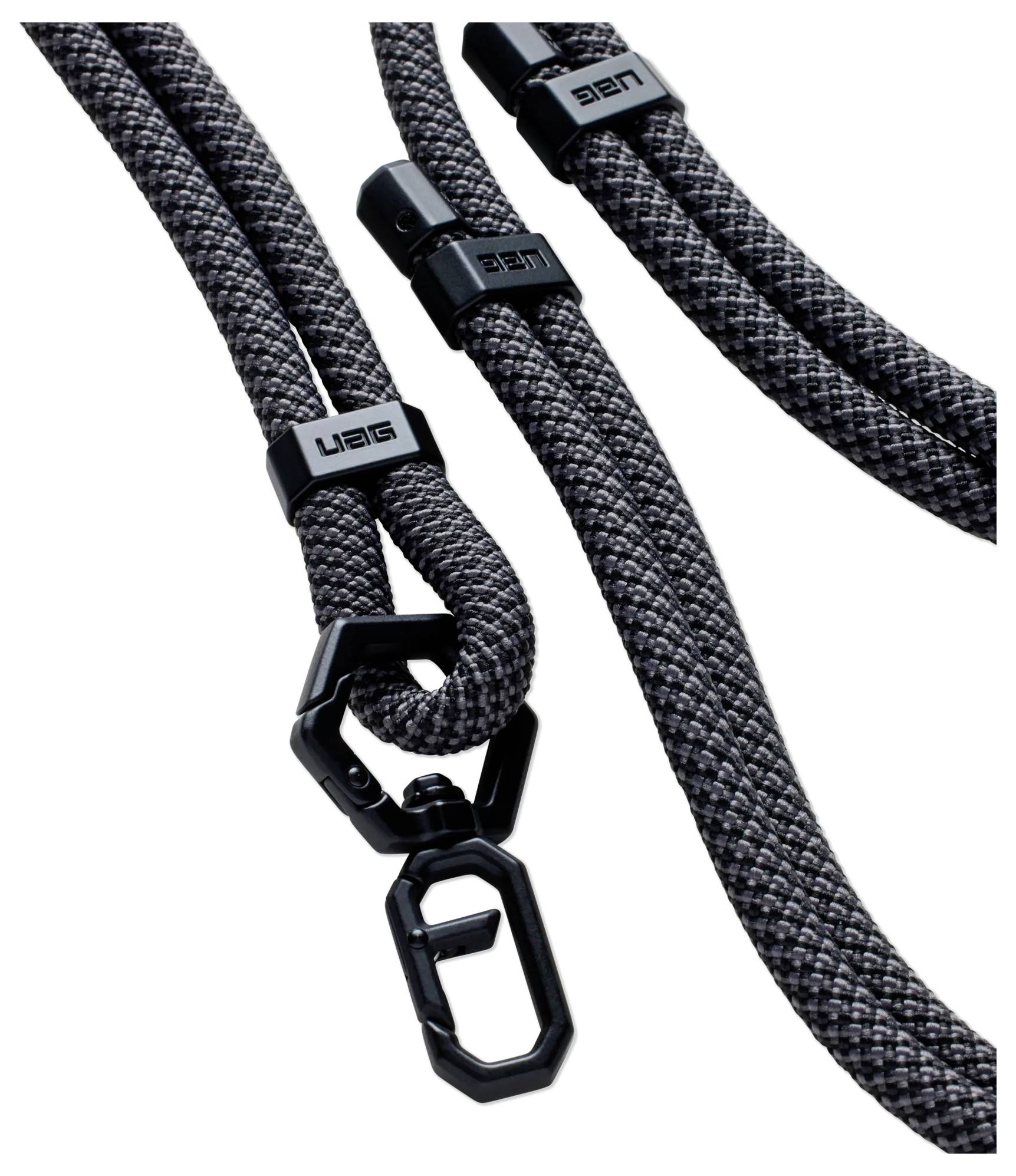 Schwarze und graue Kletterseile mit sicheren verschließbaren Metallkarabinern, entwickelt für Stärke und Haltbarkeit bei Outdoor-Aktivitäten.