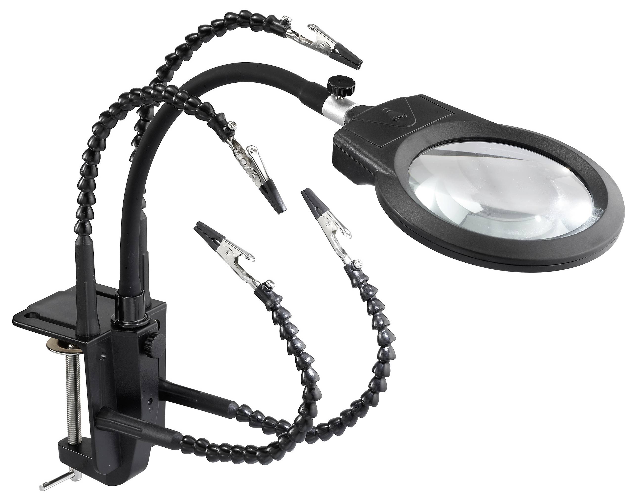 Eine Lupe mit verstellbaren Armen und Klemmen wird an einem Schreibtisch befestigt und dient für präzise Arbeiten ohne Handhalten.