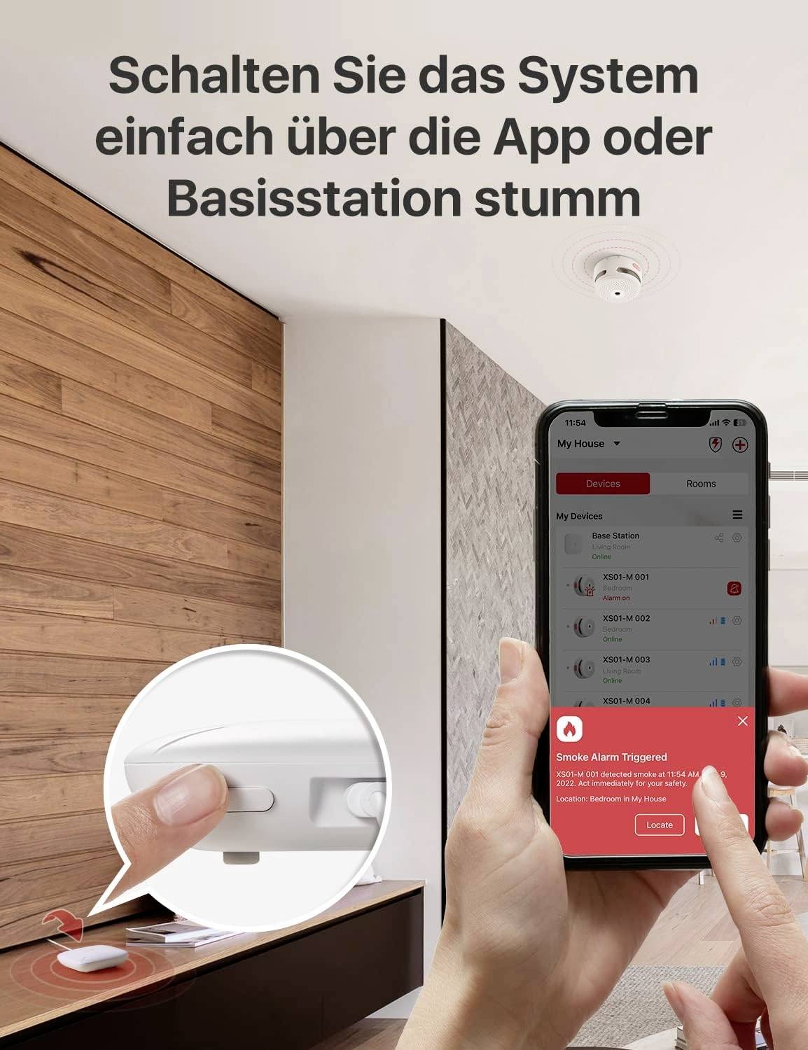 'Schalten Sie das System einfach über die App oder Basisstation stumm.' zeigt Hand, die Rauchmelder mit App steuert.
