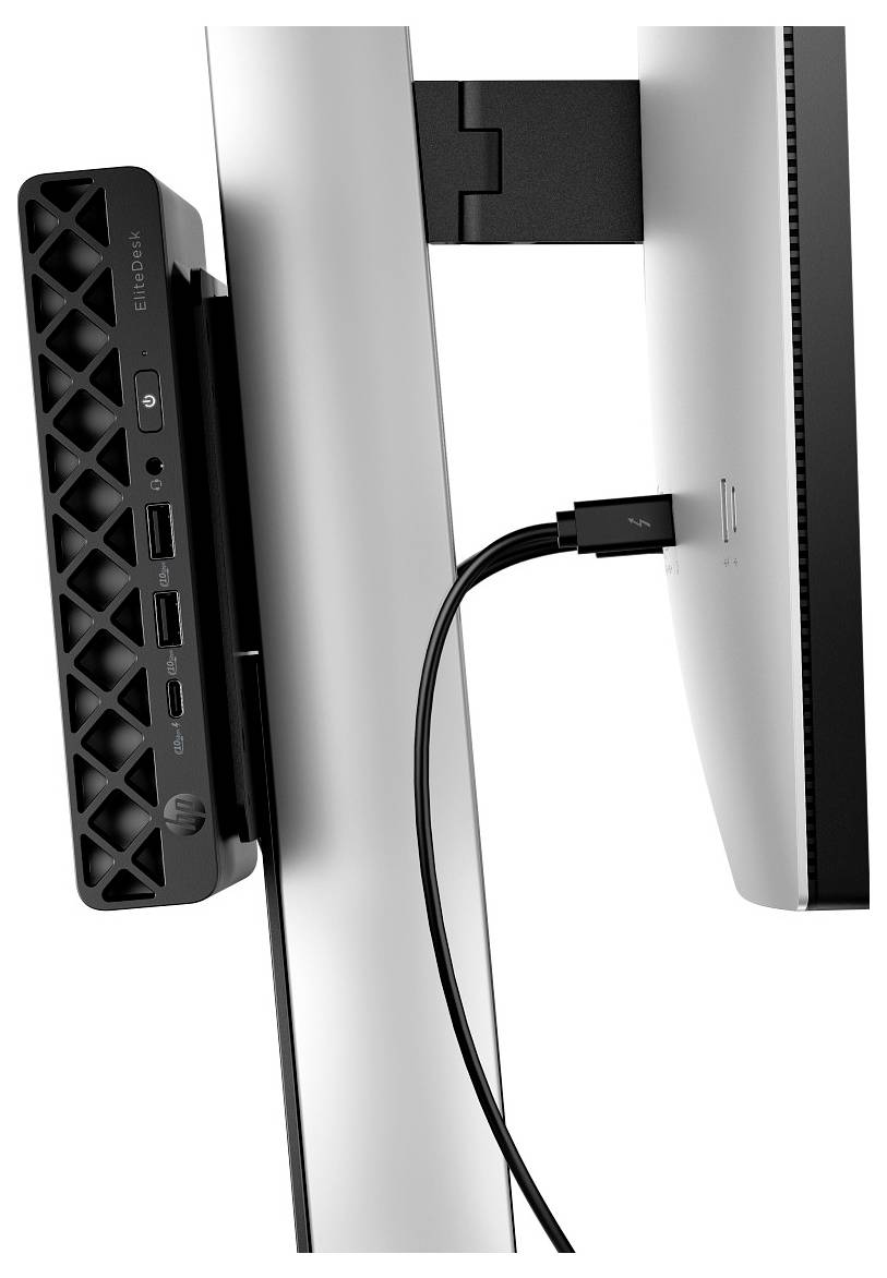 Kompaktes vertikales Dockingstation, das an der Rückseite eines Monitors befestigt ist und mehrere Anschlüsse zur Konnektivität aufweist, mit einem USB-Kabel, das eingesteckt ist.