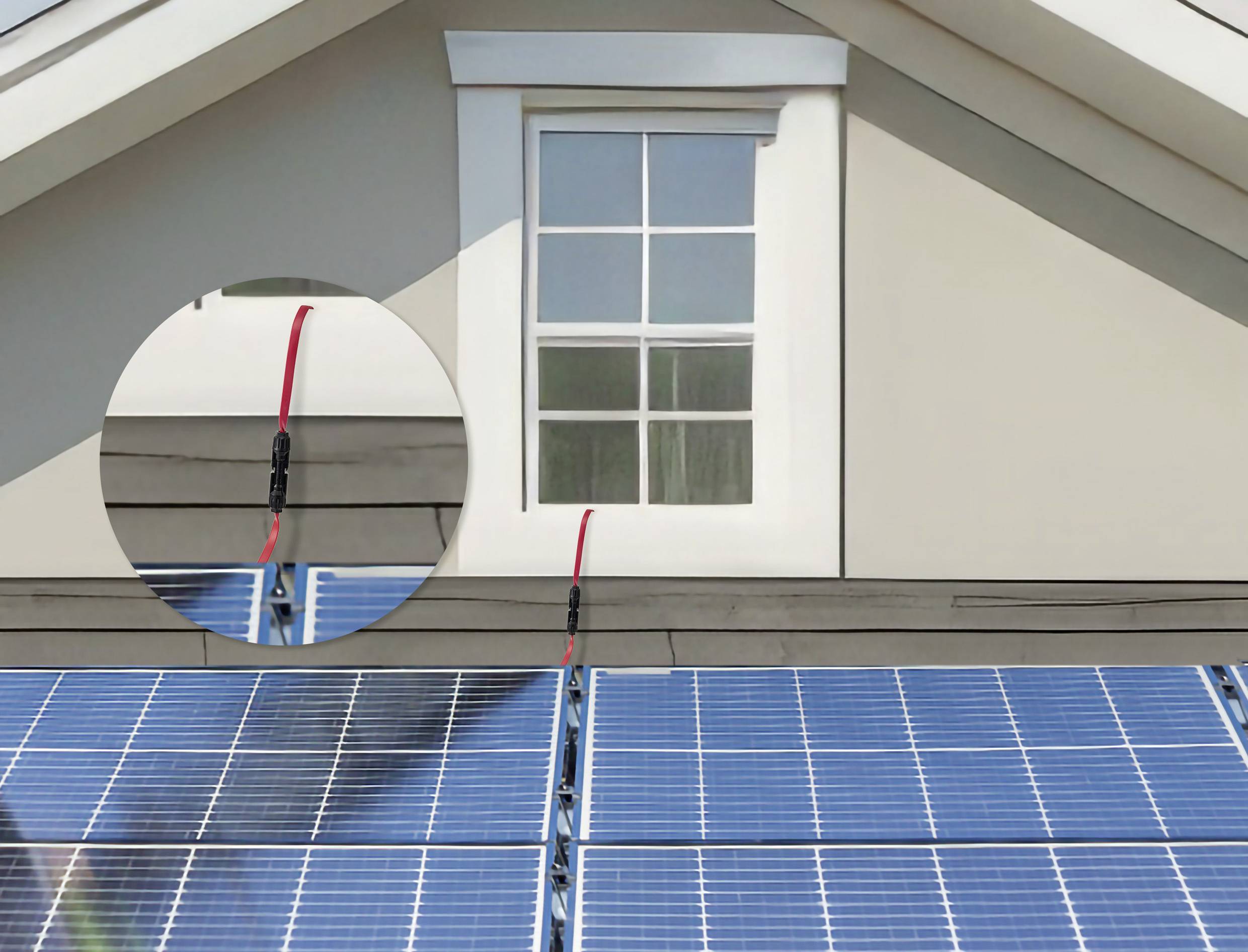 Solarzellen auf dem Dach eines Hauses unter einem Fenster, mit einer Nahaufnahme einer Verdrahtungsverbindung, die Installationsdetails zeigt.