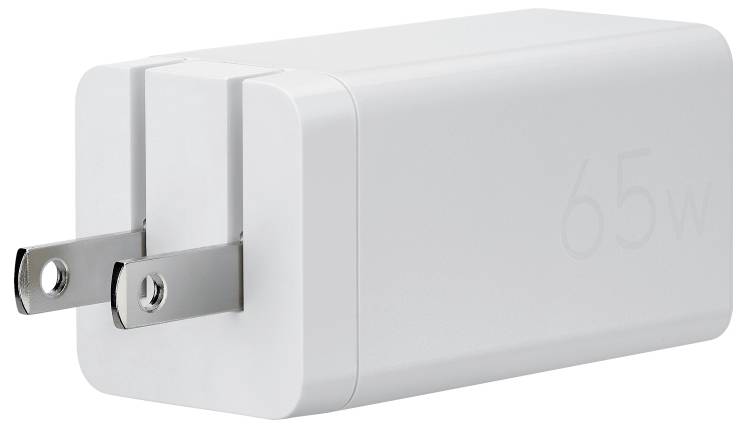 Ein weißes 65W-Wandladegerät mit eingeklappten Stiften, das zum Aufladen elektronischer Geräte verwendet wird.