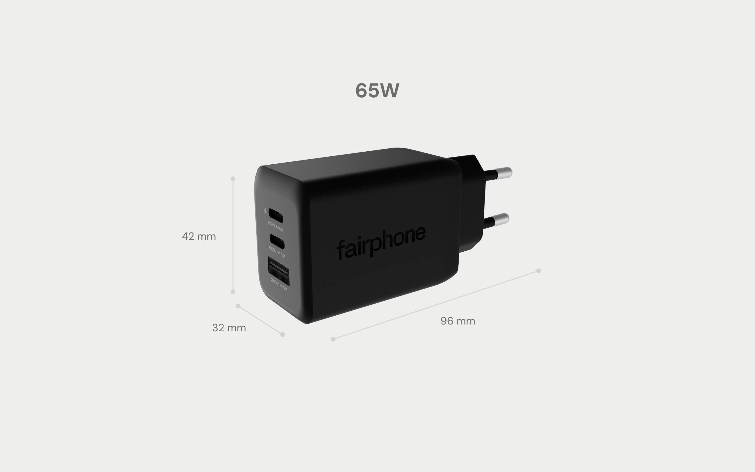 Ein schwarzes 65-W-Ladegerät mit der Aufschrift 