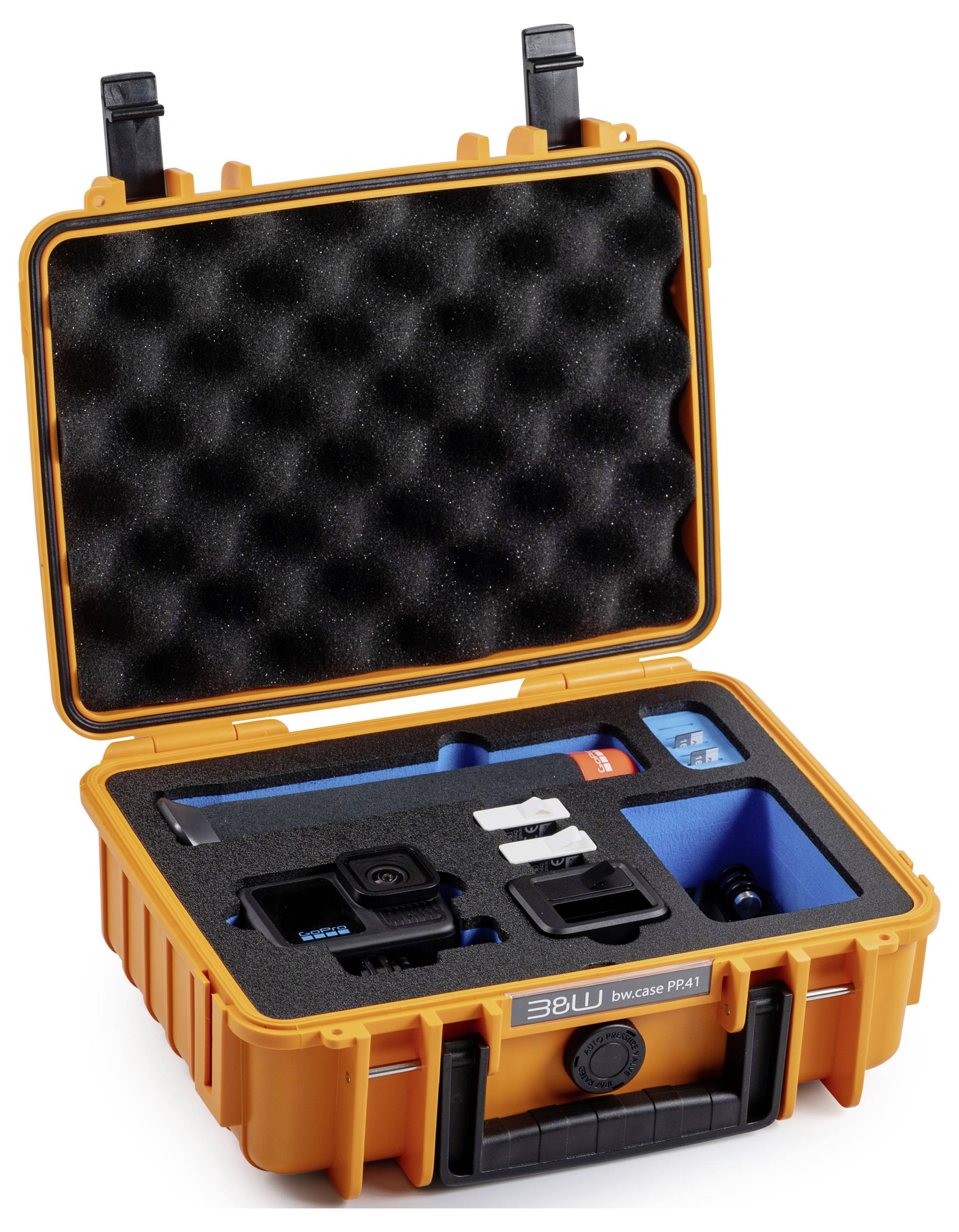 Ein offener, heller orangefarbener Schutzkoffer mit maßgefertigten Schaumstoffeinlagen, der eine Kamera, Zubehör und Ausrüstung sicher aufnimmt.