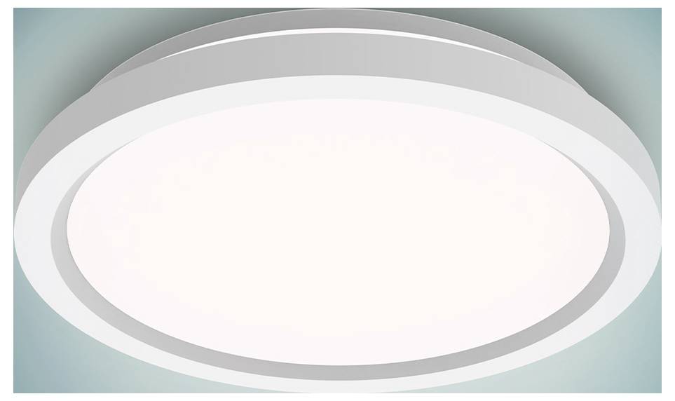 Eine kreisförmige, weiße LED-Deckenleuchte mit modernem Design, die einen sanften Schein vor einem petrolblauen Hintergrund abstrahlt.