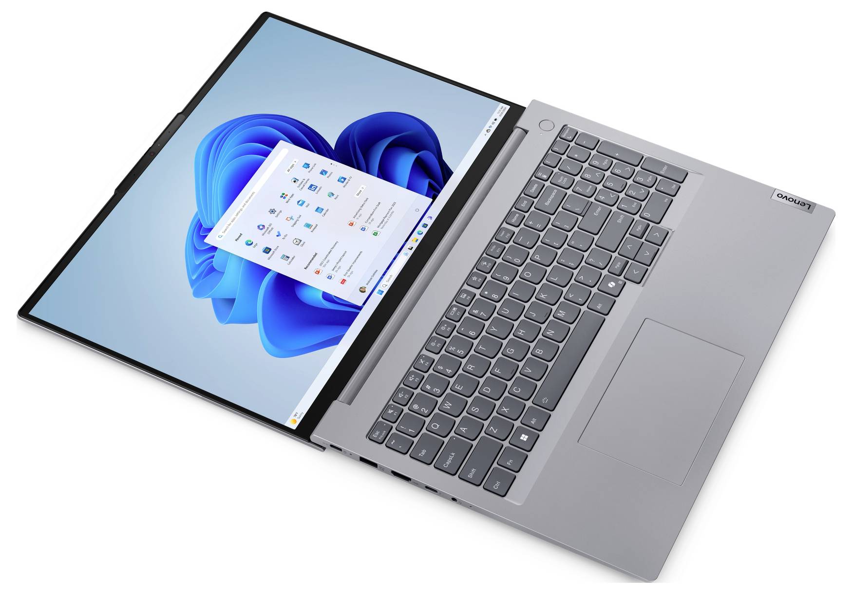 Ein silberner Laptop, flach hingelegt, zeigt einen Bildschirm mit blauem Hintergrund und geöffneten Anwendungsfenstern. Die Tastatur ist sichtbar.